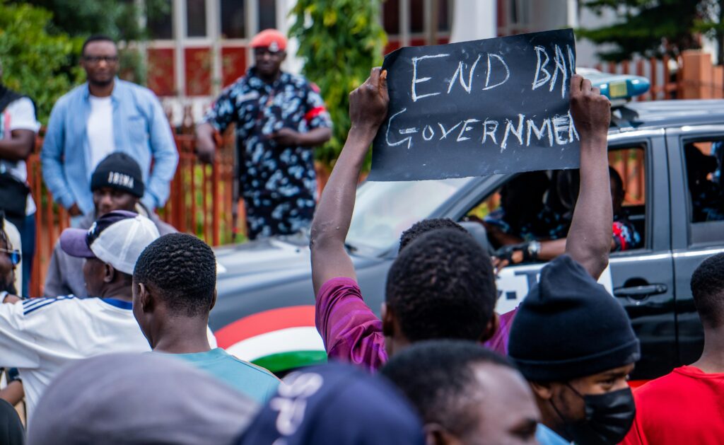 Demonstrators in Nigeria express political discontent with an 'End Bad Government' sign.