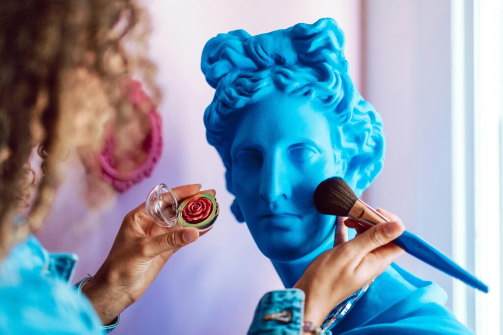 A vibrant reinterpretation of a classical sculpture with modern makeup application.